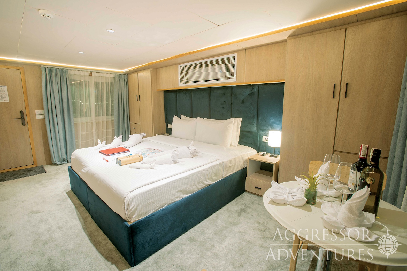 Balcony Stateroom with King bed and panoramic windows aboard Philippines Aggressor II