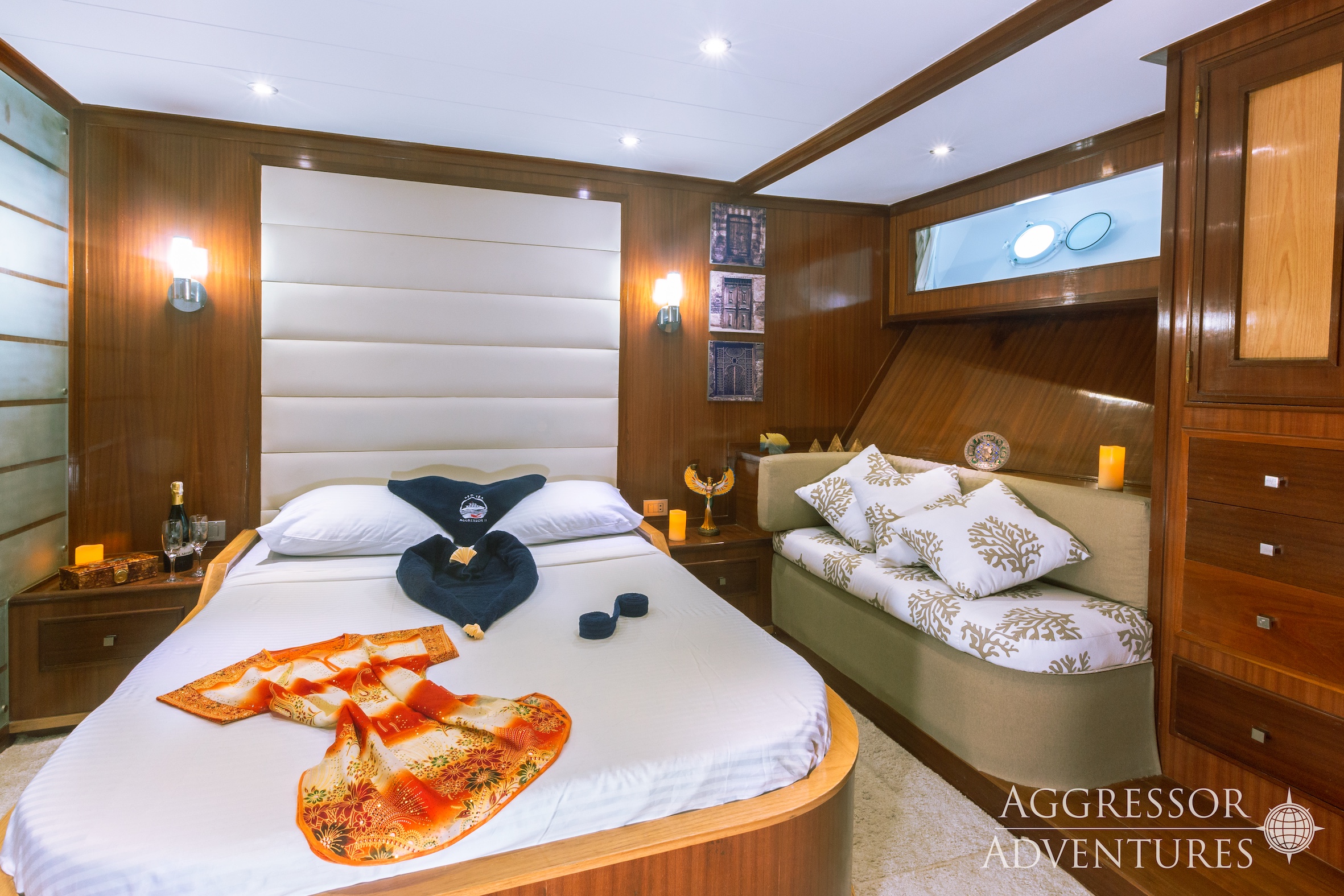 Luxury master suite stateroom with queen bed and panoramic windows aboard Red Sea Aggressor II