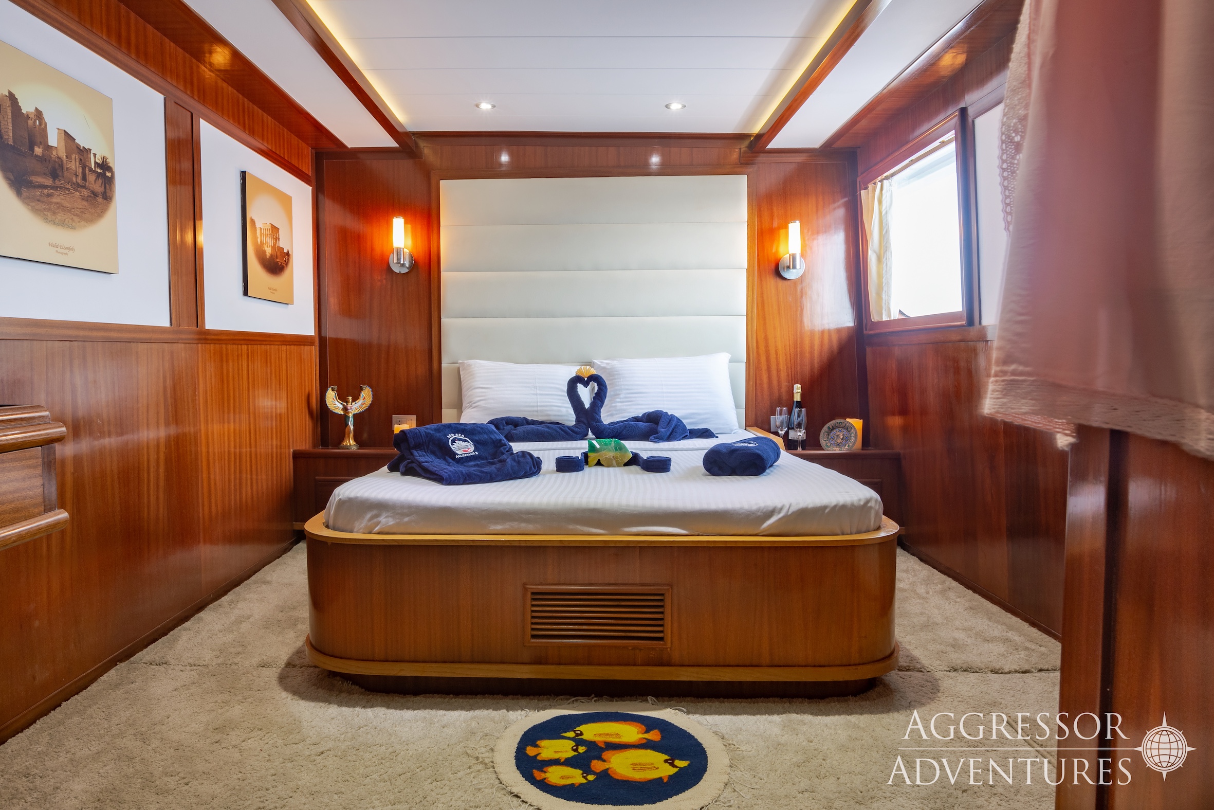 Spacious Master stateroom with queen bed and picture window on the Red Sea Aggressor II