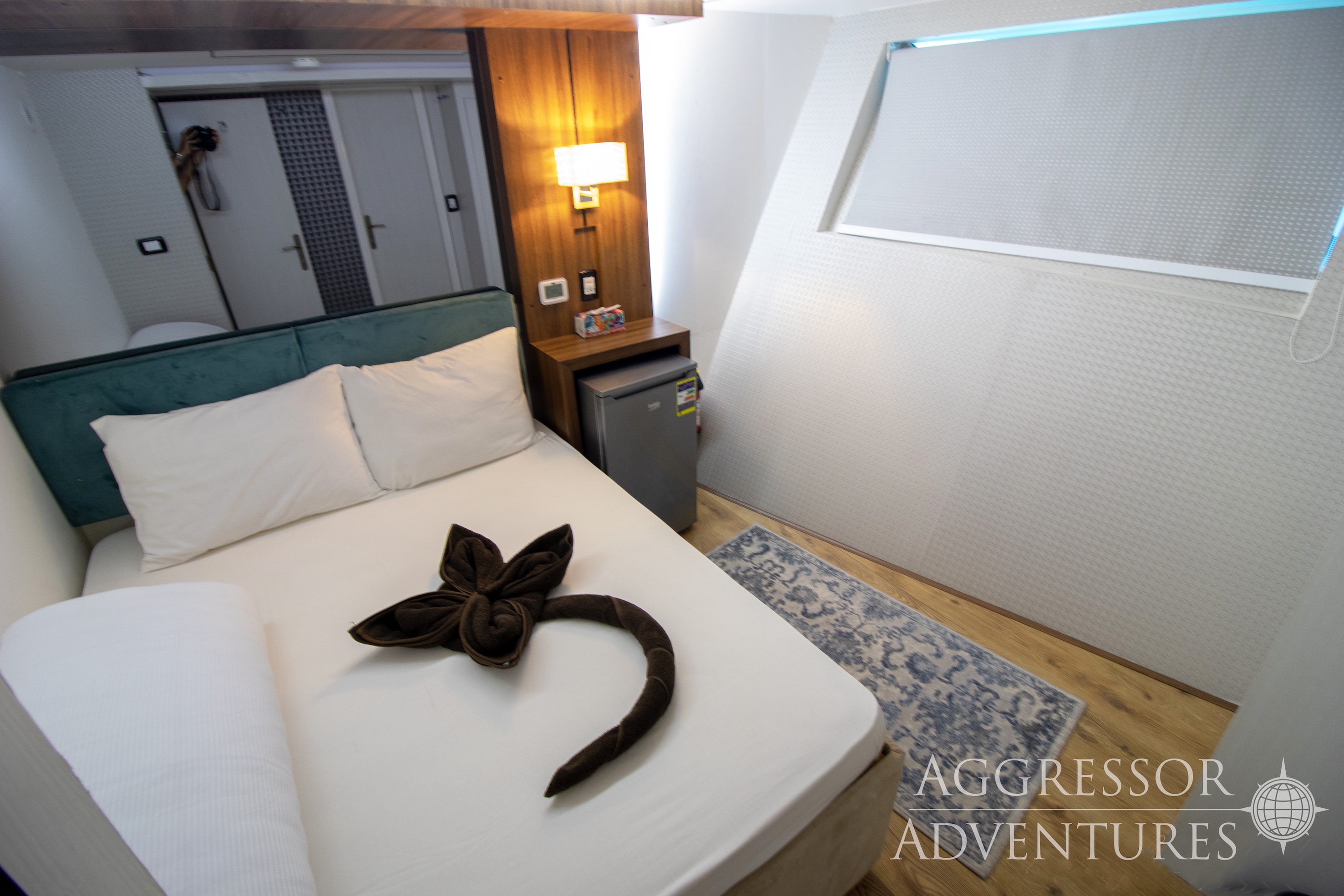 Spacious Master stateroom with queen bed and picture window on the Red Sea Aggressor IV