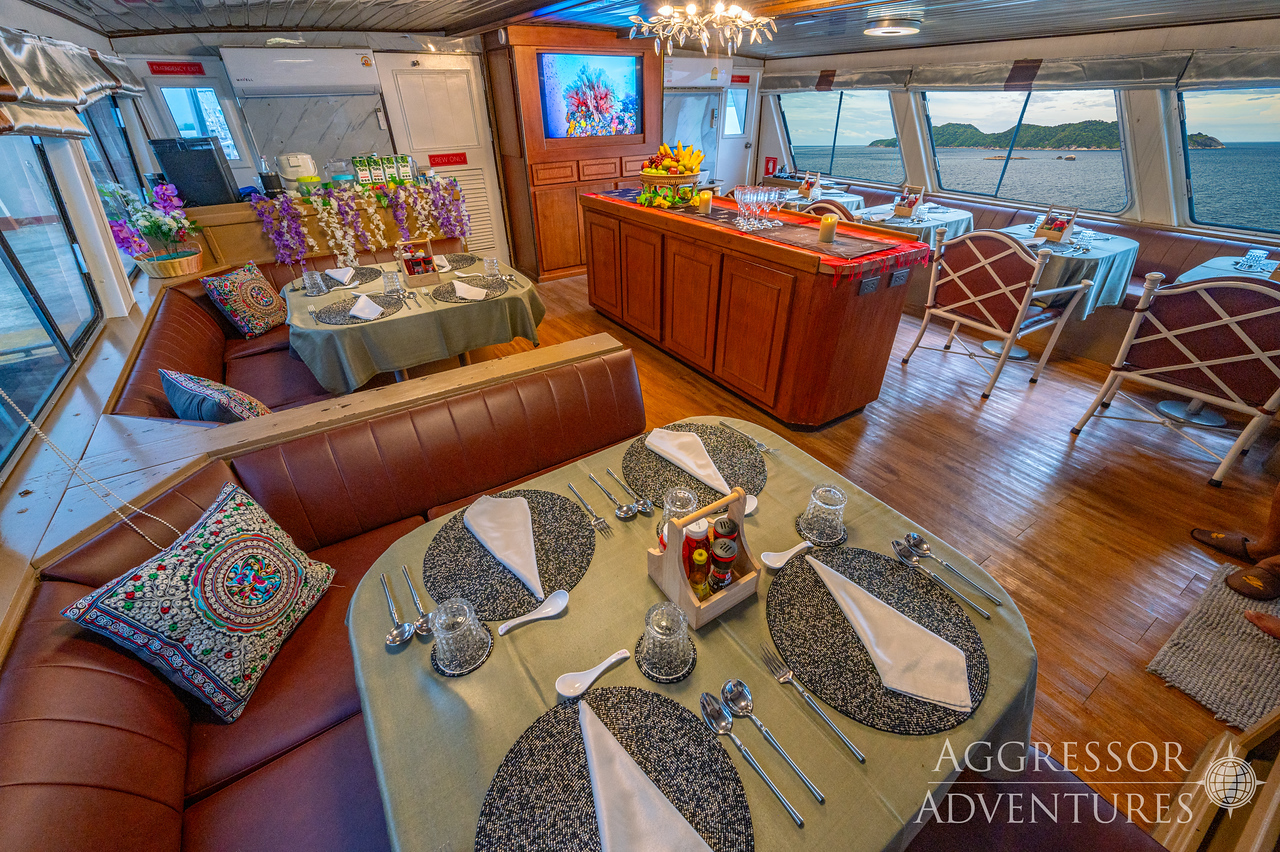 Spacious dining area for delicious meals prepared by the yacht's chef aboard Thailand Aggressor